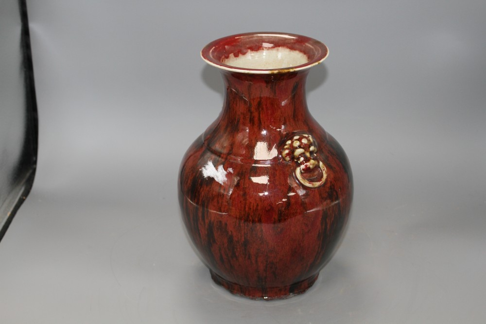 A Chinese flambe vase, with lion mask ring handles to the shoulder, H. 28.5cm